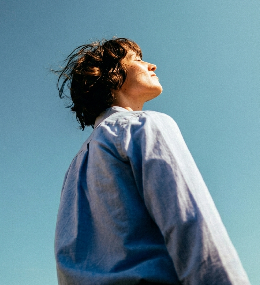 Person feeling peaceful looking at sky